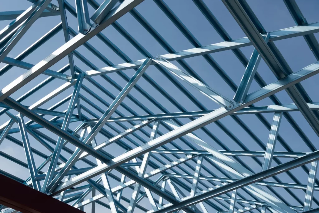 Industrial steel framework and pipelines forming part of a large facility, illustrating the strength and precision of materials provided by a trusted structural steel supplier in Singapore